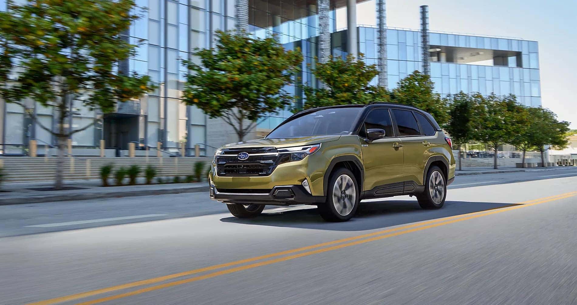 subaru forester hybrid driving down the street