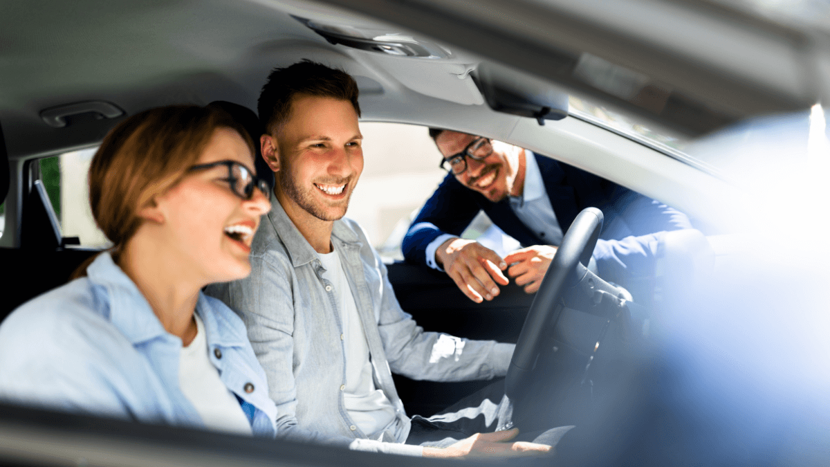 Happy couple exploring the features of their new Toyota