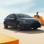 A black Toyota Corolla in the middle of a skate park