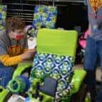Geeks for Kids helping decorate wheelchairs