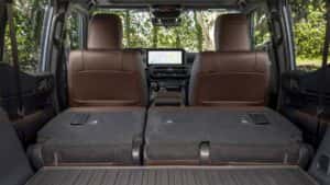 Interior shot of the Toyota Land Cruiser showing the rear seats folded down for expanded storage