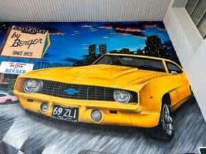 Close up of the painted 1969 Daytona Yellow Camaro ZL1 in Berger's mural