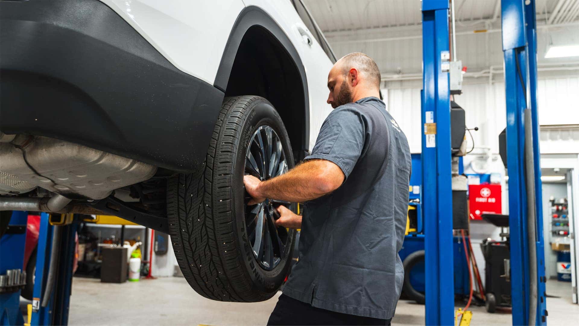 technician changing brakes