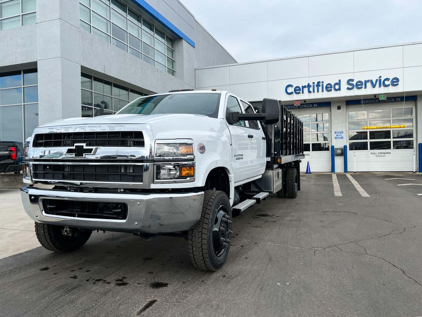 Chevy Silverado Stake Bed in front of Berger's Service Department