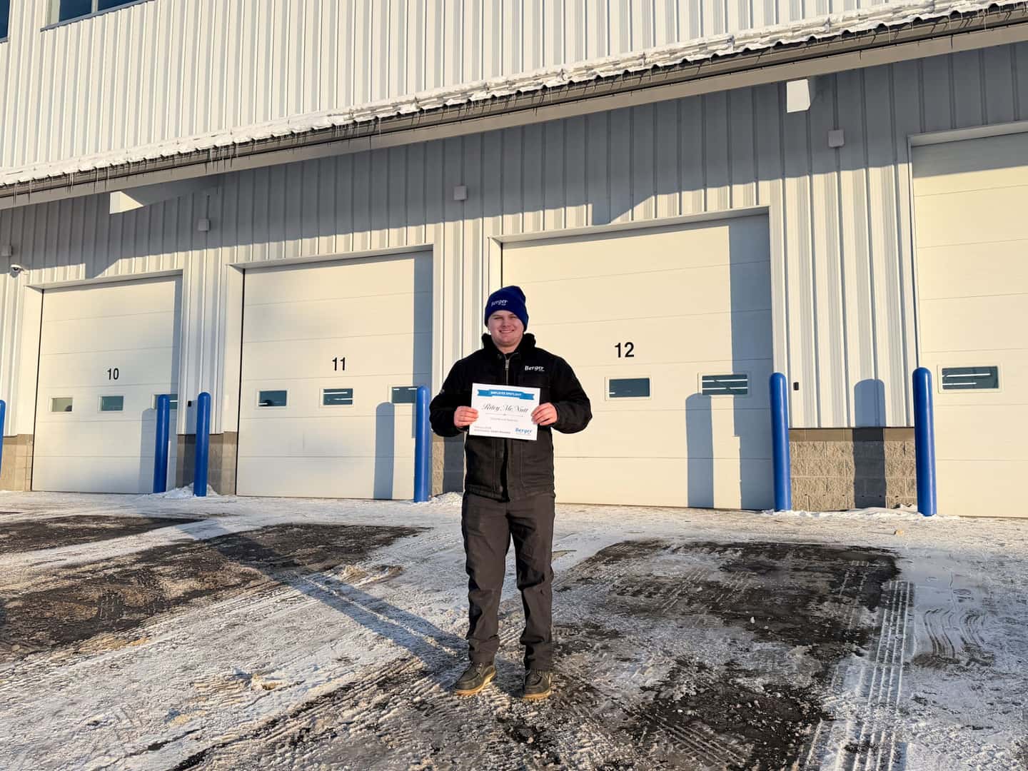 Riley with his Employee Spotlight certificate