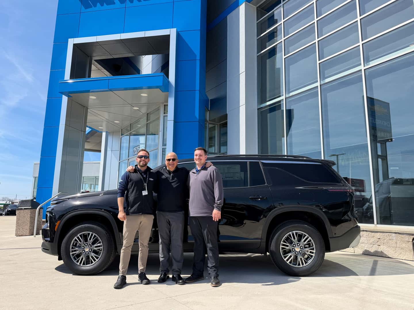 Berger Sales Team in front of a Chevy Traverse