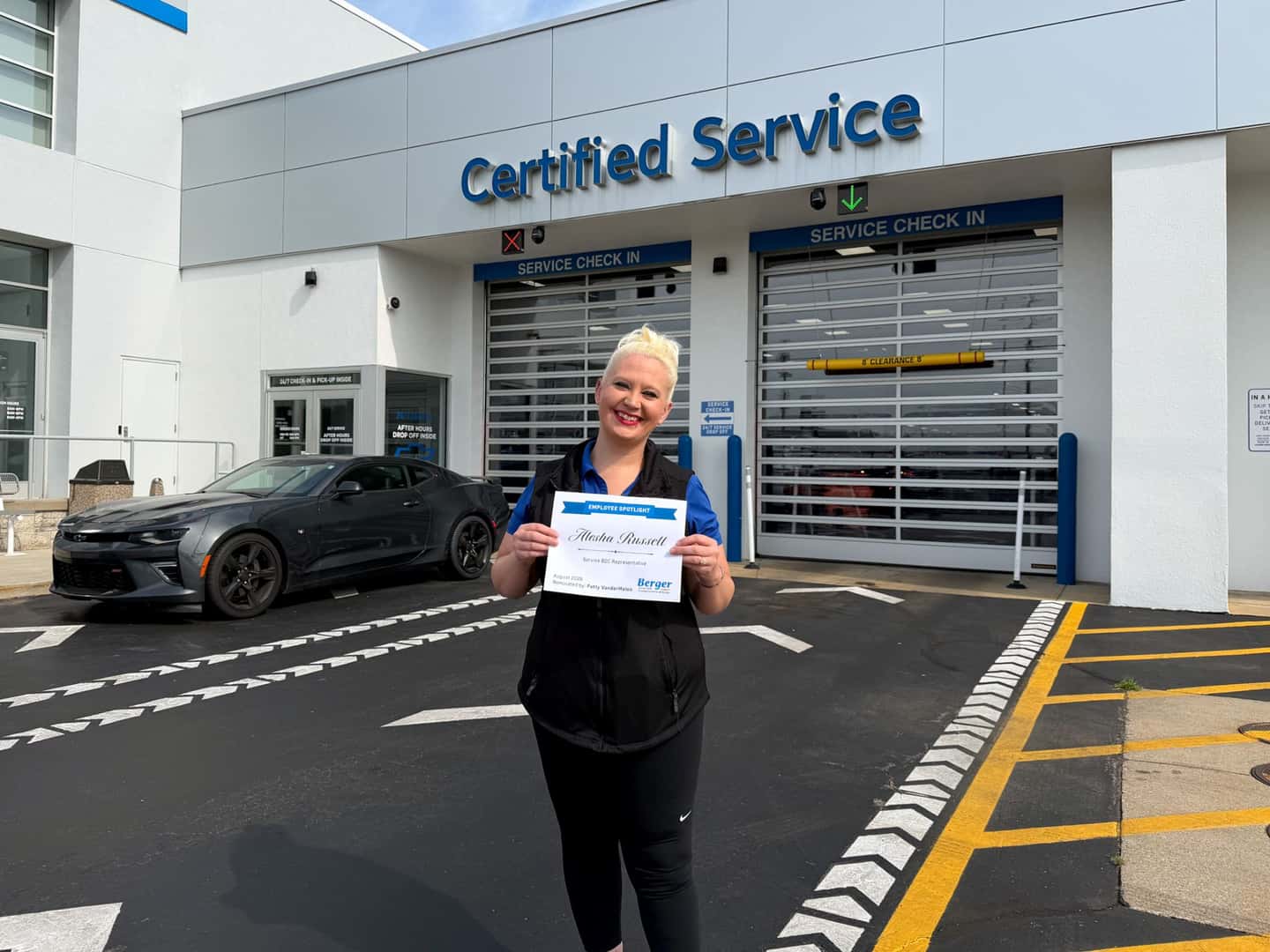 Alesha with her Employee Spotlight certificate