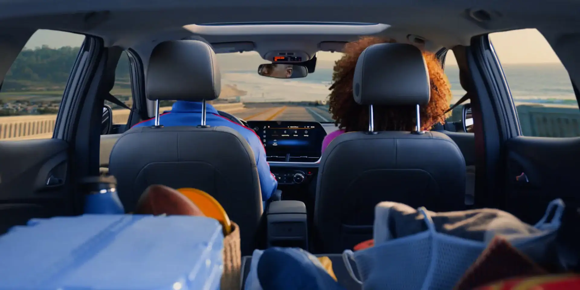 View through the Chevrolet Trax cabin showing rear seats folded for extra cargo room