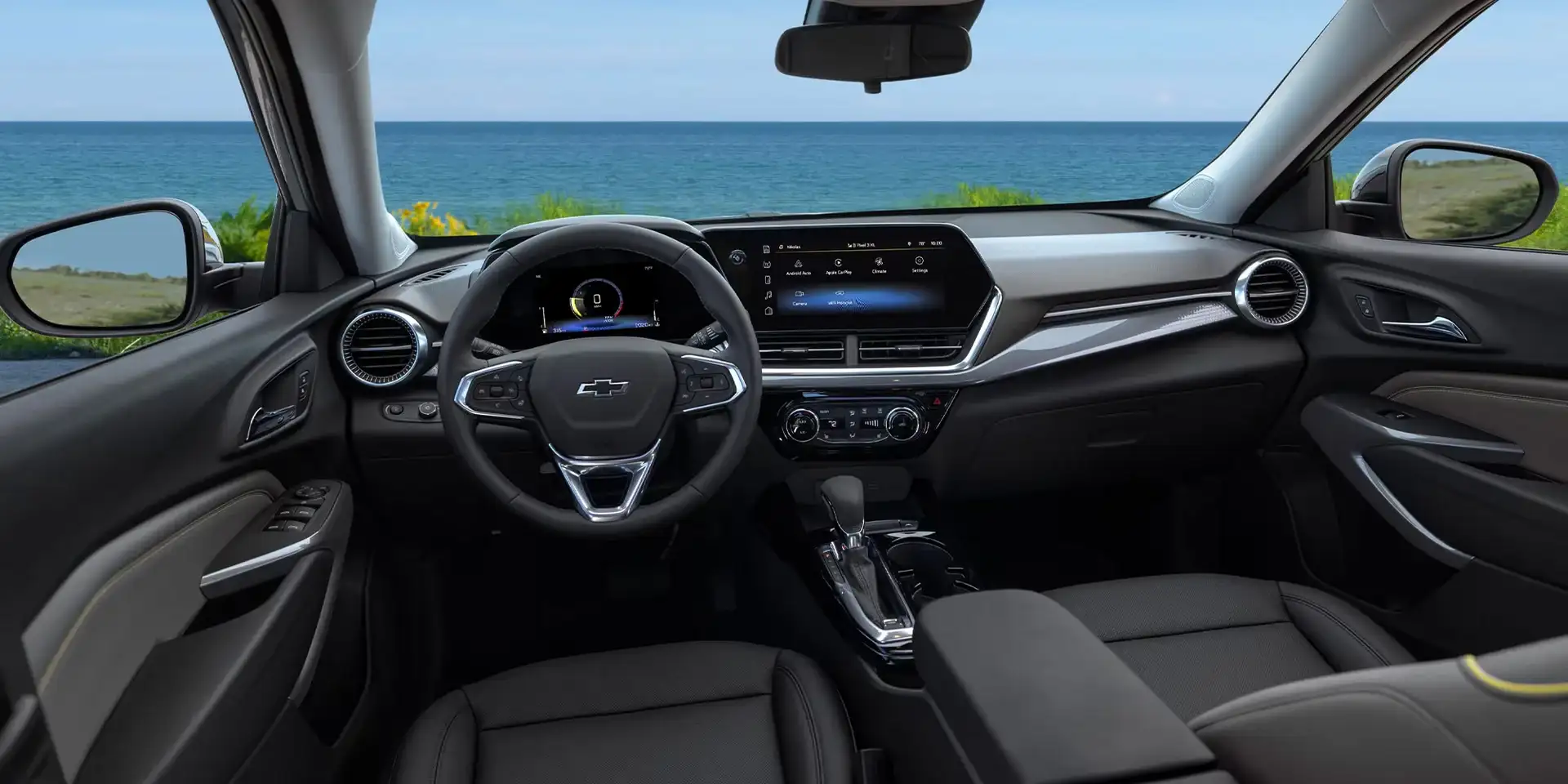 Chevrolet Trax interior viewed from the passenger side showing the dashboard and front seats