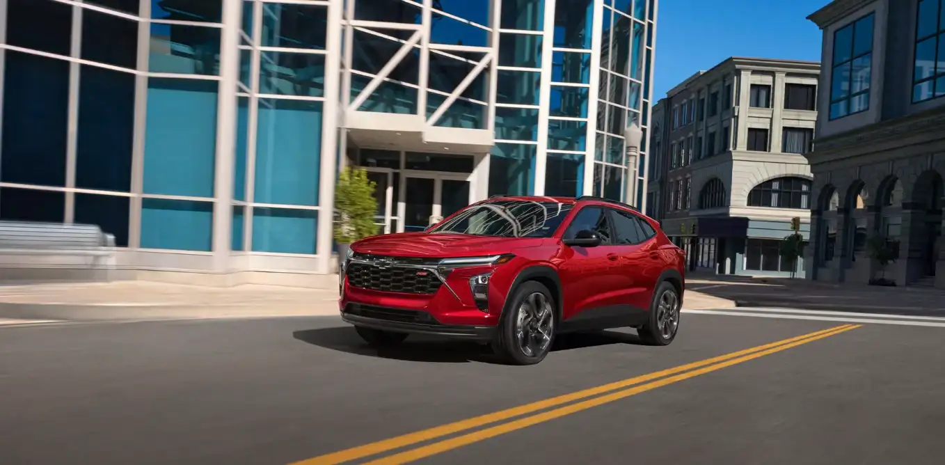 Red Chevrolet Trax front three-quarter view on a city street
