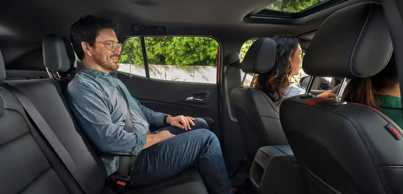Passenger seated in the rear of the Chevrolet Trax with the driver ahead