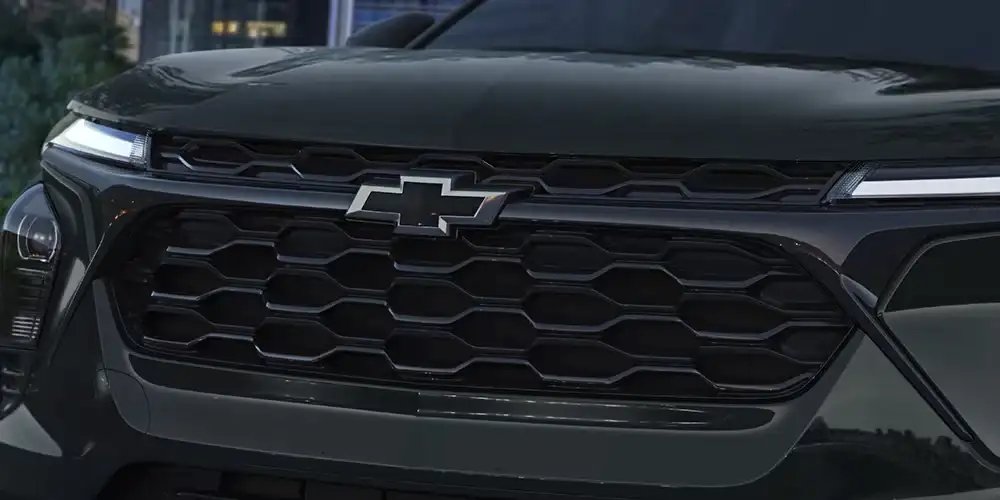 Close-up of the blacked-out grille and black Chevrolet bowtie badge