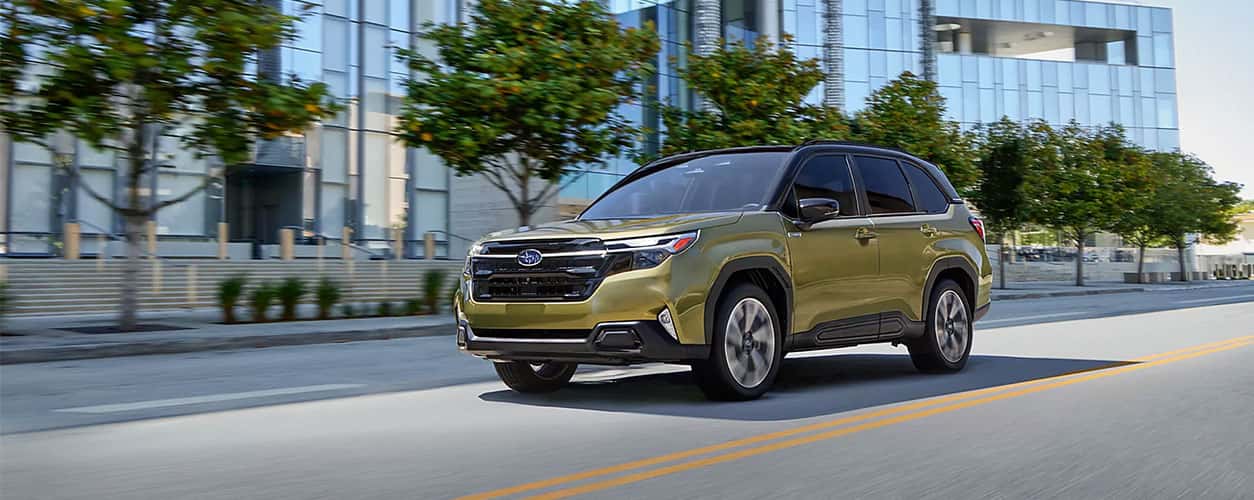 2025 Subaru Forester Hybrid on the road in green