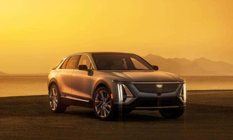 2024 Cadillac LYRIQ parked on a beach at sunset