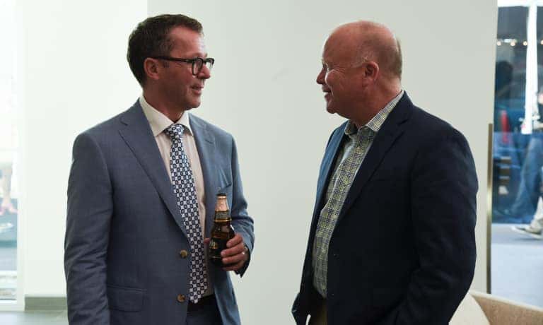 Guests conversing at the Cadillac of Calabasas Grand Reopening ribbon ceremony