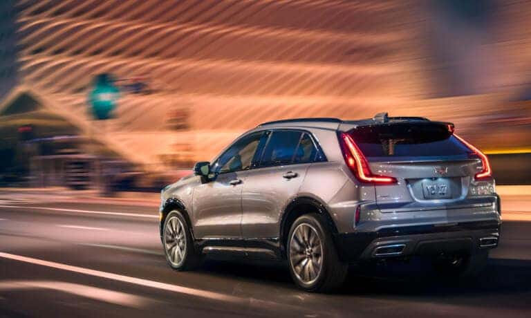 2025 Cadillac XT4 driving through a green light