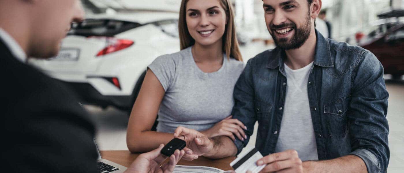 Couple receiving car keys