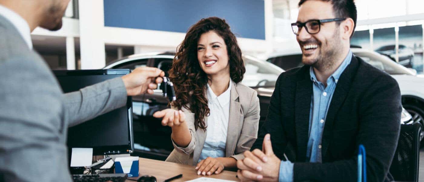 Couple receiving car keys