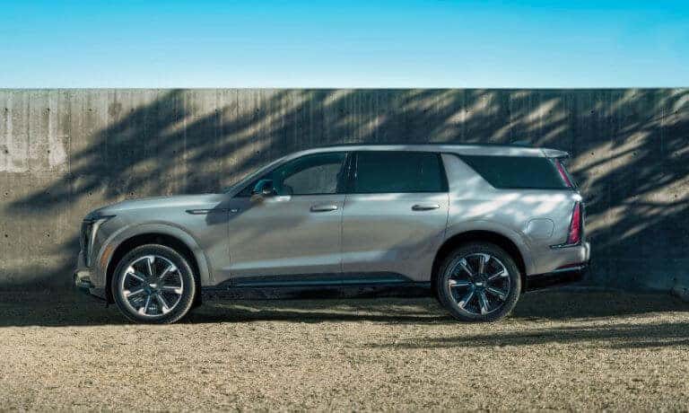 2026 Cadillac ESCALADE IQL side view by fence