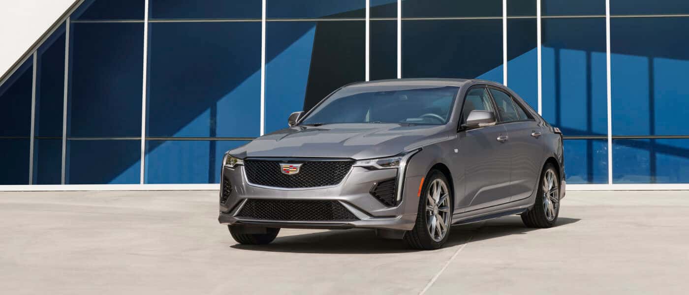 2026 Cadillac CT4 parked by glass building