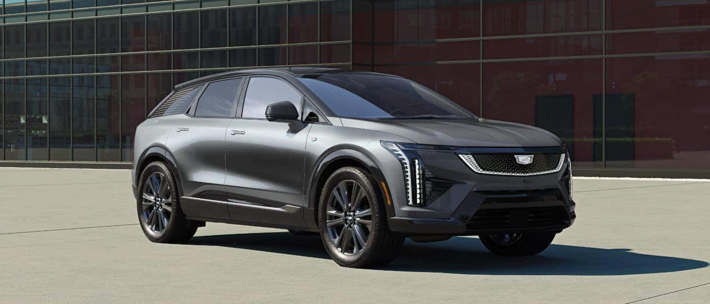 2027 Cadillac OPTIQ parked in front of windows