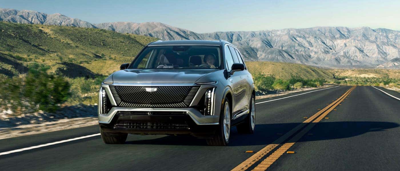 2026Cadillac-VISTIQ-ExteriorDrivingOnMountainHighway