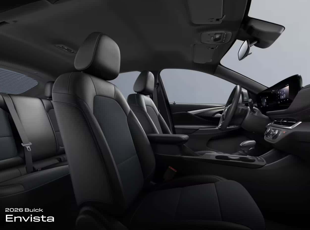 Interior of a 2026 Buick Envista, showing modern black leather seats, sleek dashboard with digital display, and a spacious, elegant design.