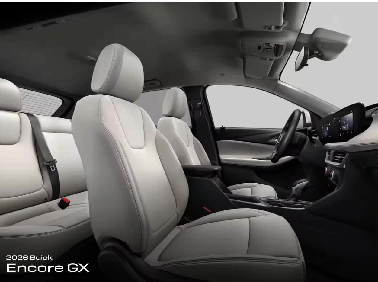 Interior view of a 2026 Buick Encore GX showcasing sleek white leather seats, modern dashboard with digital display, and an elegant, spacious design.
