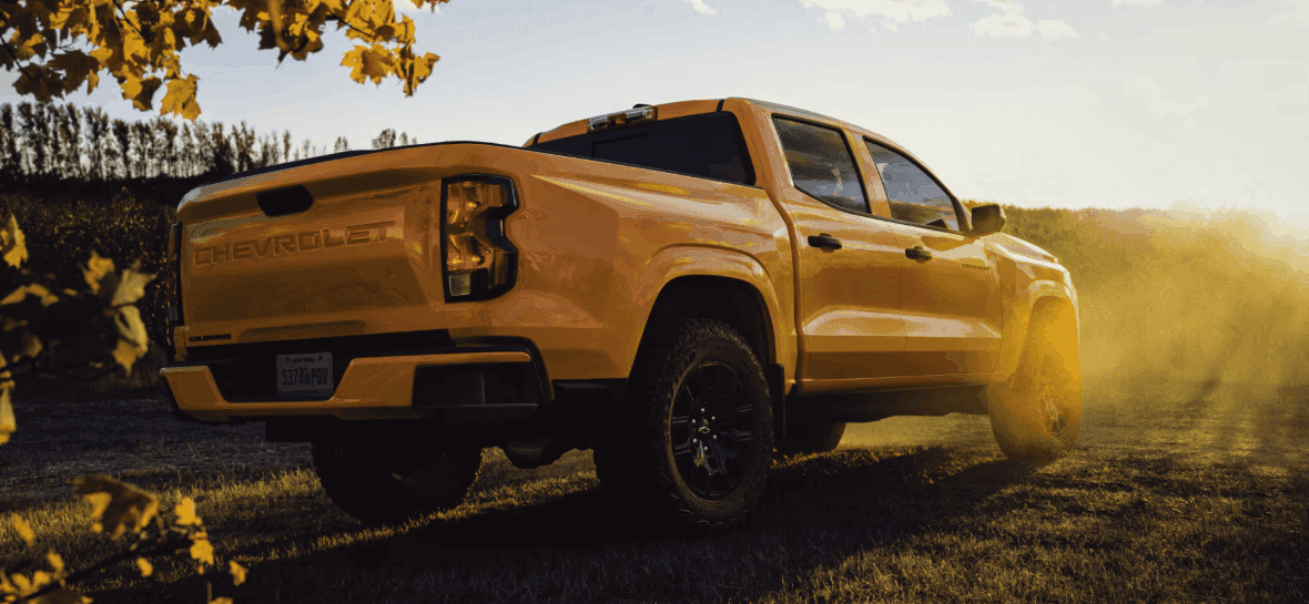 2026 Chevy Colorado Z71 towing a trailer on a Kentucky highway showcasing best-in-class 7700-pound capacity