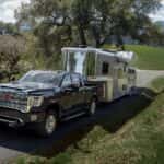 Black 2021 GMC Sierra 2500 HD Denali towing a trialer