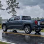 2026 GMC Sierra 1500 on a wet longleaf-pine road in Rockingham, NC during hurricane season