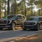 2026 GMC Acadia and 2026 GMC Yukon parked side by side on a Sandhills pine road near Aberdeen, NC