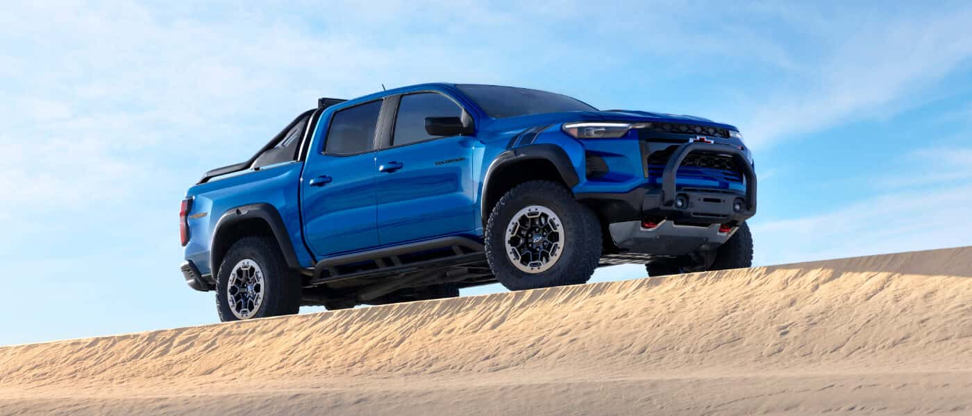2026 Chevy Colorado parked on a sand dune