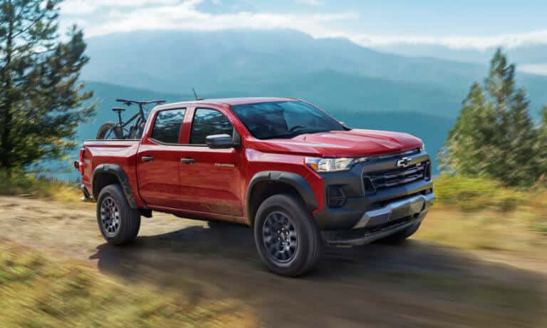 2026 Chevy Colorado on mountain road with bikes in bed