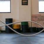 Female athlete working out with ropes