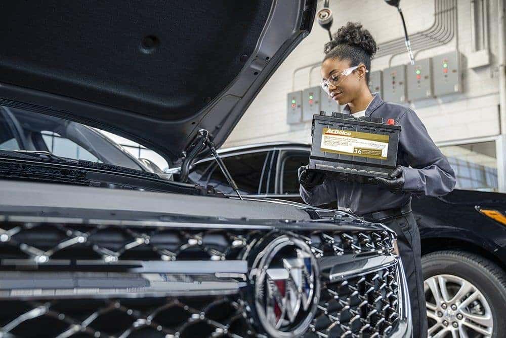 Service Professional Changing out a Battery on a Buick