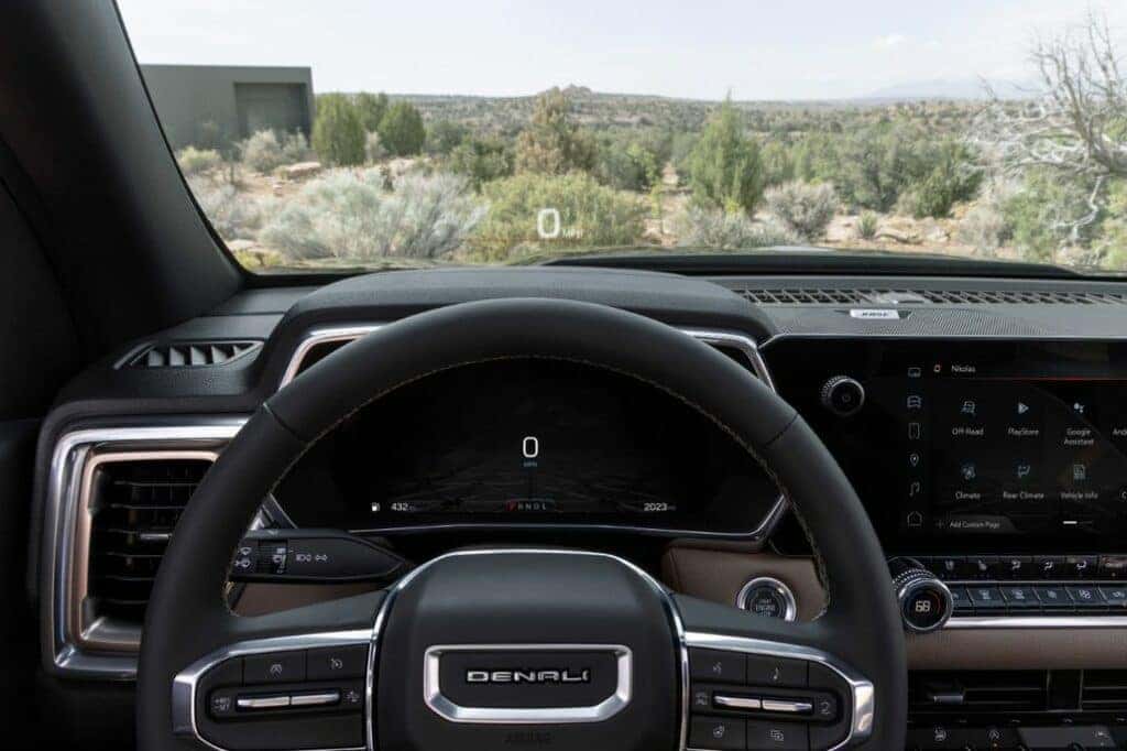 Detail view of GMC Canyon Denali interior from driver's perspective with Head-Up Display shown.
