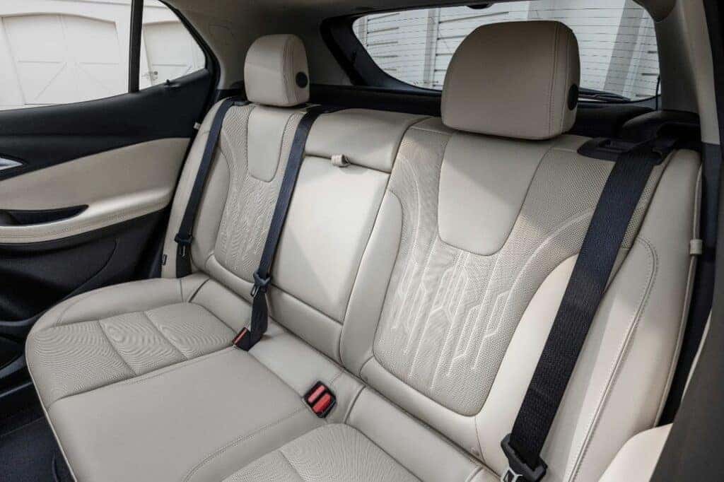 View of the rear seats in 2024 Buick Encore GX Avenir with Whisper Beige and Jet Black interior. Preproduction model shown. Actual production model may vary. Available in Spring 2023.