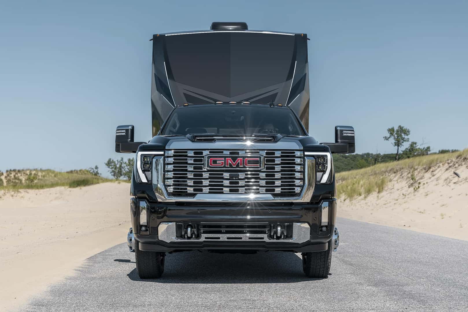 GMC Sierra 3500 HD Denali towing a trailer