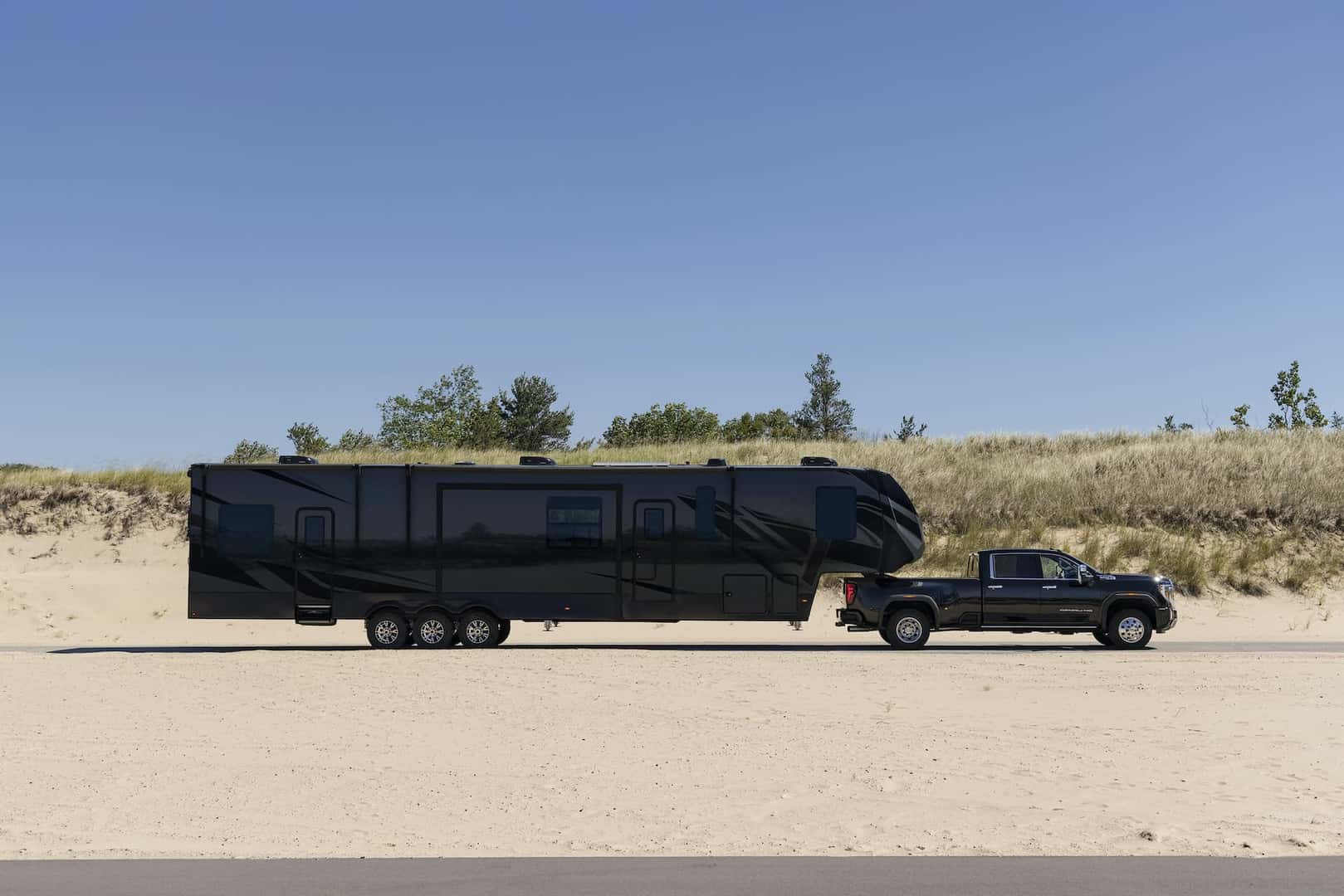GMC Sierra 3500 HD Denali towing a trailer