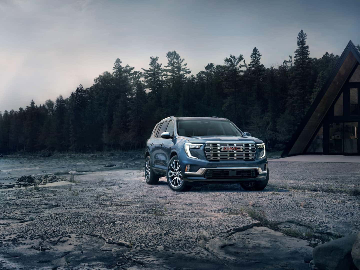 The Glamorous GMC Acadia Denali On The Edge Of A Sparse Forest