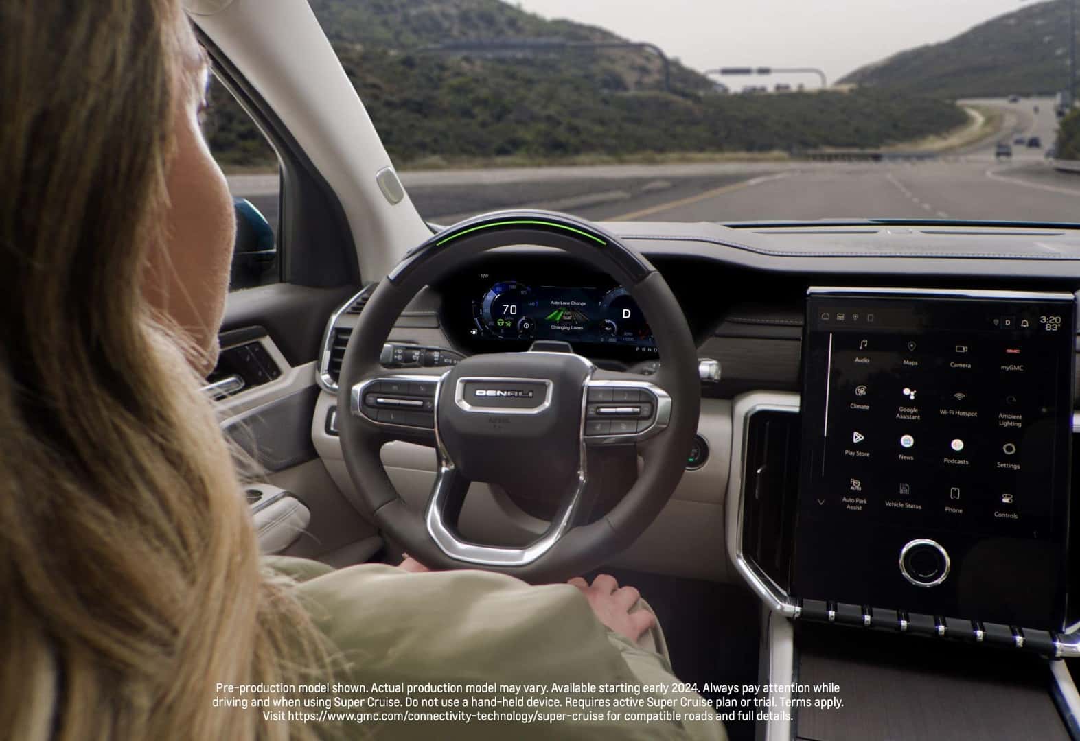 A Cheery Blonde Woman Cruising With Her 2024 GMC Acadia Denali