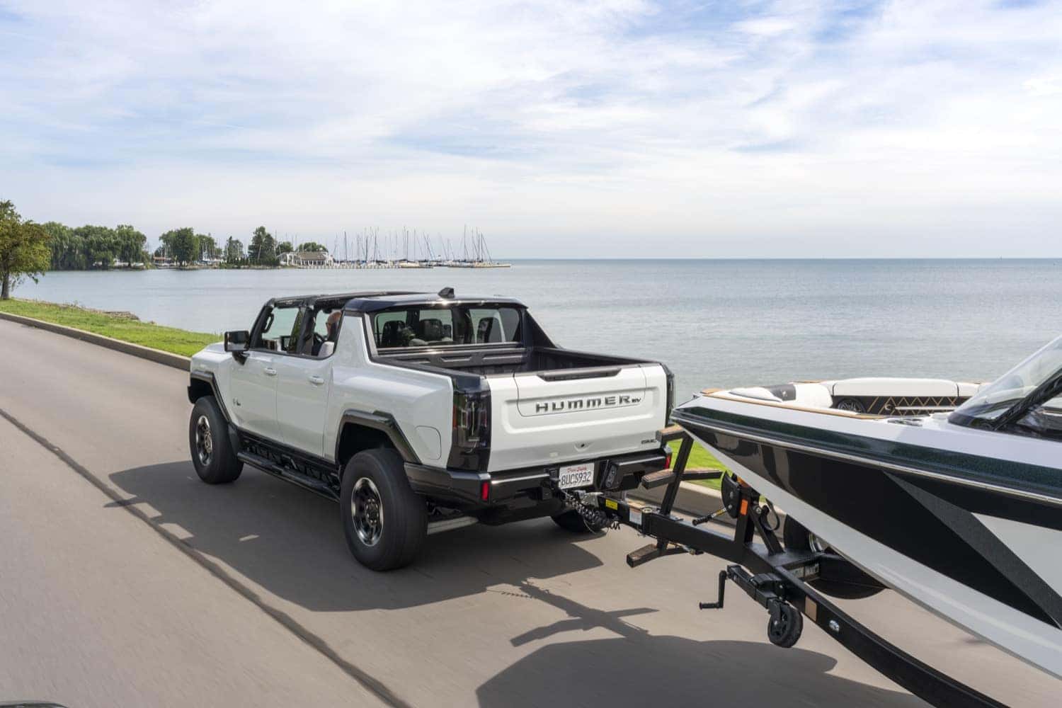 Interstellar White 2023 GMC Hummer towing