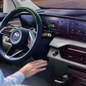 A Driver Sitting Down Into The Driver Seat Of The Comfy 2025 Buick Enclave