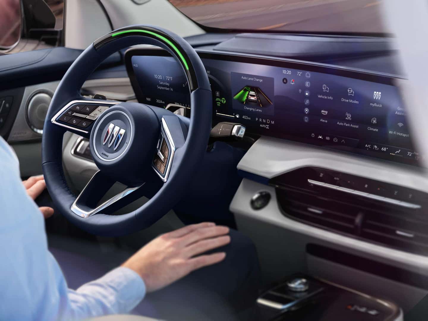 A Driver Sitting Down Into The Driver Seat Of The Comfy 2025 Buick Enclave