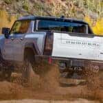 2024 GMC Hummer EV rear view mud