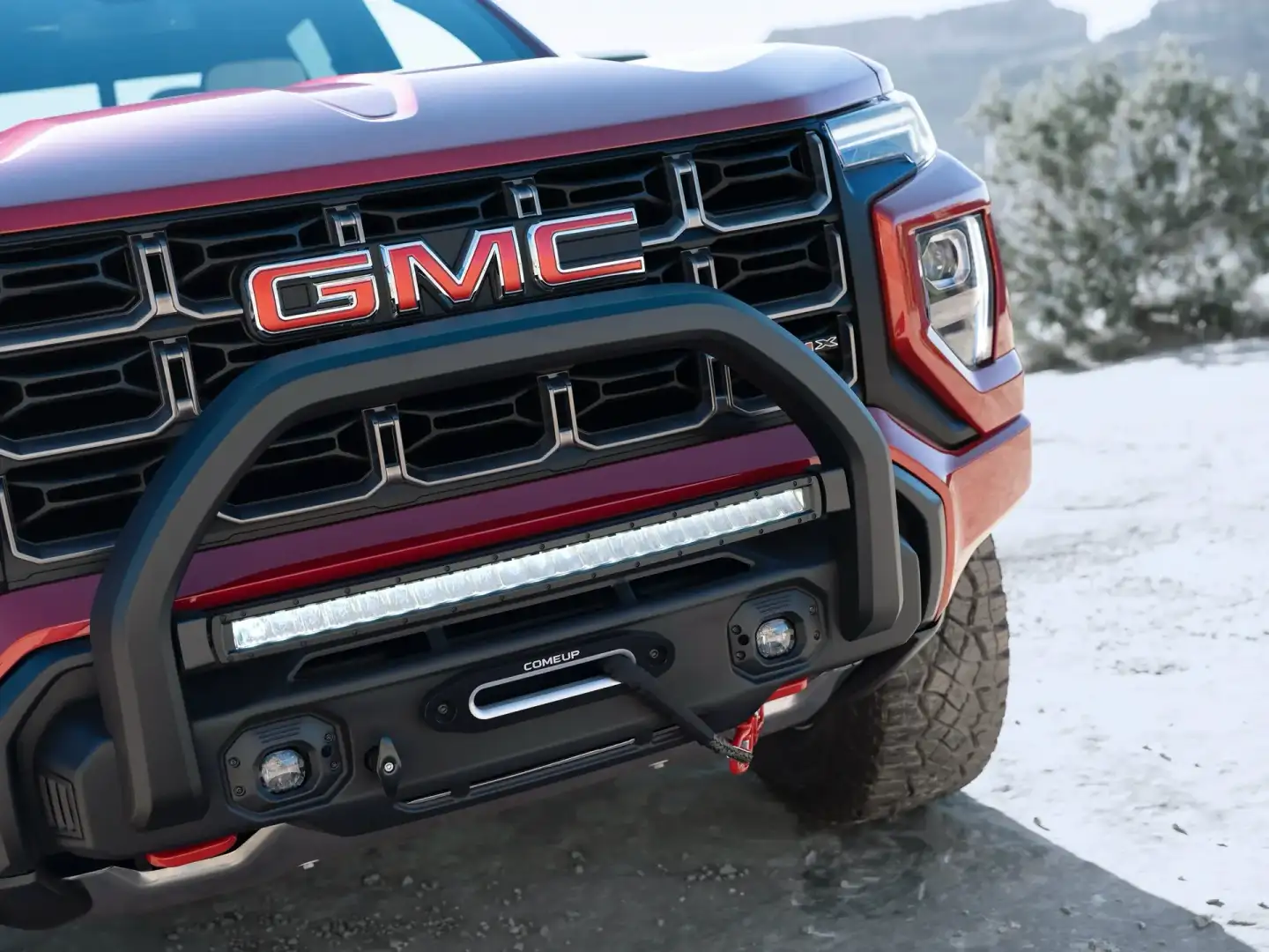 Red GMC Canyon front view of the grill