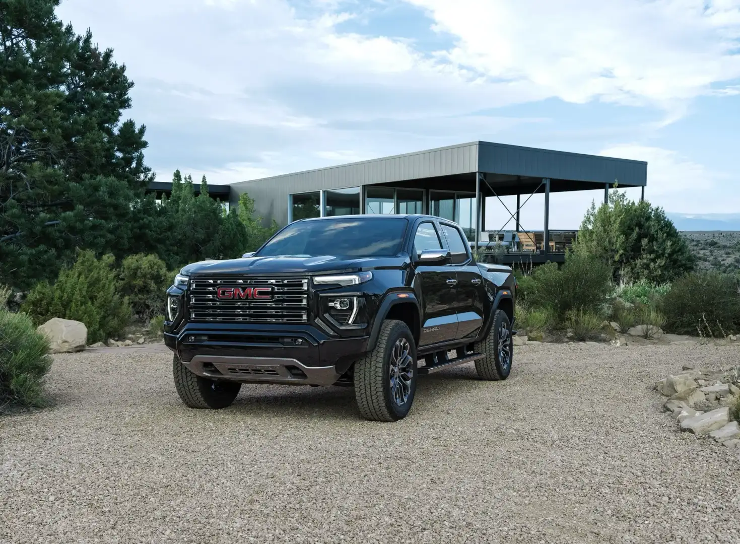 Black GMC Canyon Denali parked in a driveway