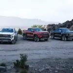 Lineup of GMC Canyon parked off road on a mountail