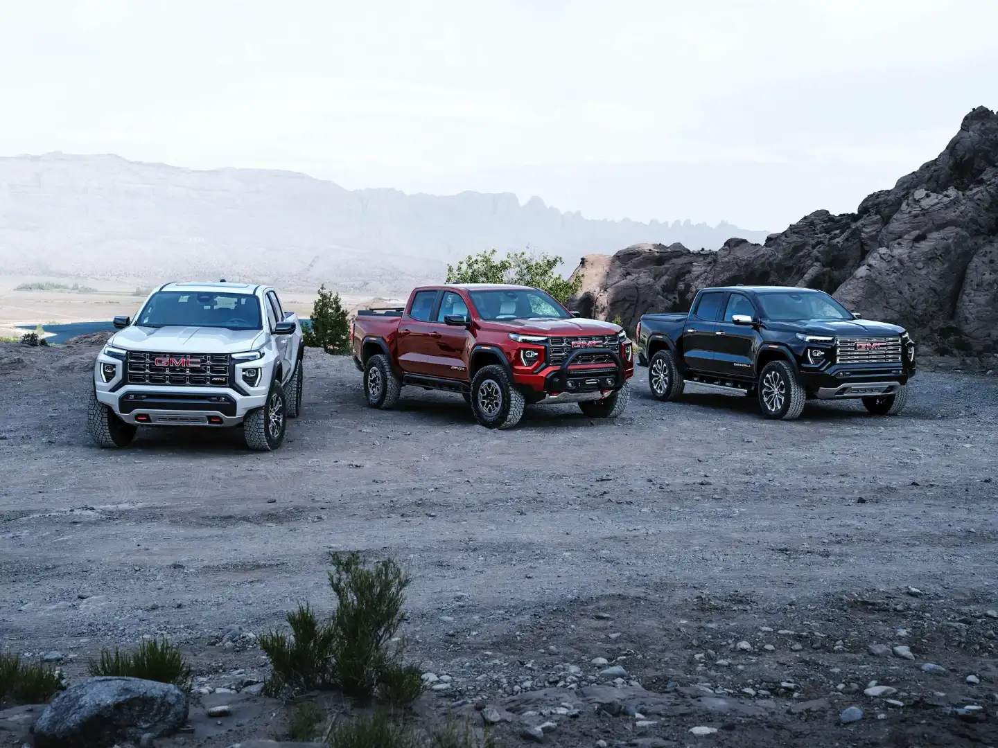 Lineup of GMC Canyon parked off road on a mountail